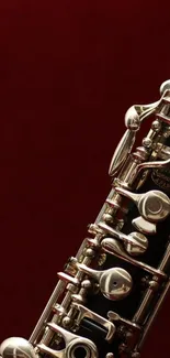 Clarinet on a dark red background, elegant and musical image.