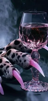 Crystal glass with pink drink and claw on smoky background.