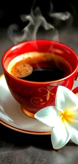 Steaming red coffee cup with white flower