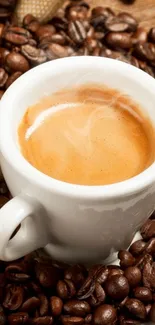 Steaming espresso in a white cup with coffee beans.