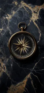 A vintage compass on marble background.