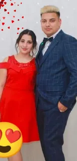 Elegantly dressed couple posing gracefully in vibrant red and blue outfits.