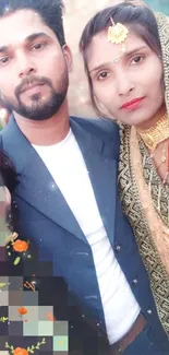 Portrait of a couple in traditional attire with floral decorations.