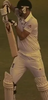 Cricketer in white gear poised for action on the field.