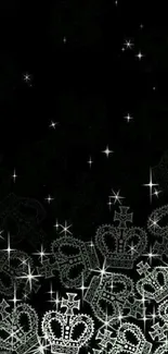 Mobile wallpaper with sparkling crowns on black.