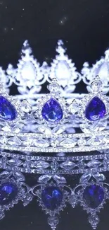 Elegant jeweled crown with vibrant blue gems on dark background.