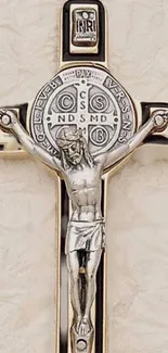 Detailed crucifix depiction in silver on a beige background.