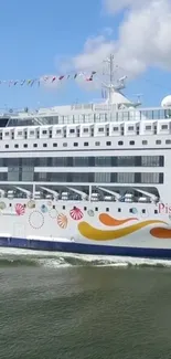 Elegant cruise ship on open waters with clear sky and vibrant design.