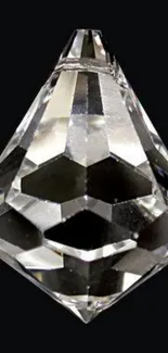 Faceted crystal diamond on black background wallpaper.