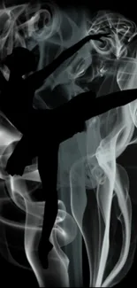 Silhouette of a dancer against swirling smoke.