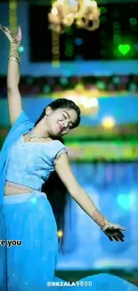 Dancer in vibrant blue attire surrounded by a festive backdrop.