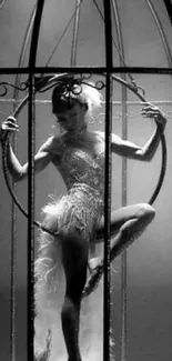 Graceful dancer elegantly posed inside a birdcage in monochrome style.