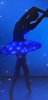 Silhouette of a ballet dancer against a vibrant blue background.