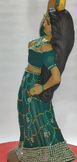 Elegant teal statue in graceful dance pose with intricate beadwork.