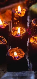 Dark candles with a warm flickering glow, perfect for ambiance.