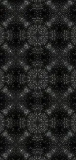 Dark kaleidoscope pattern wallpaper with geometric design.