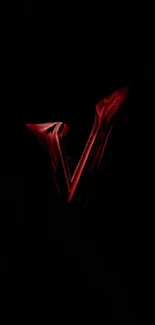 Dark wallpaper with a vibrant red 'V' design on a black background.