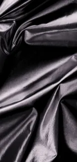 Dark satin fabric with elegant texture.