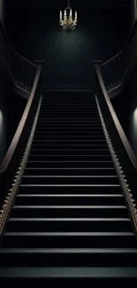 Dark staircase with chandelier lighting.