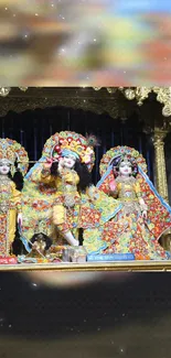 Three detailed deities in vibrant attire on ornate gold background.