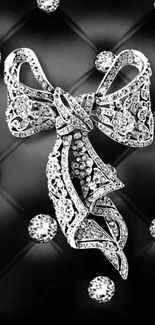 Diamond bow on a black quilted background, elegant and luxurious.