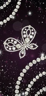 Diamond butterfly and beads on purple starry background.