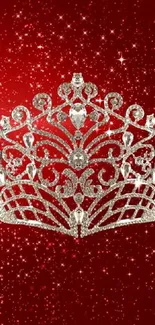 Sparkling diamond crown on red glitter background.