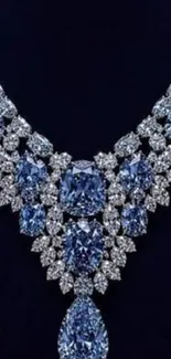Sparkling blue diamond necklace on dark blue background.