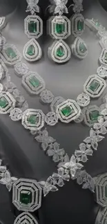 Intricate diamond and emerald necklaces on display.