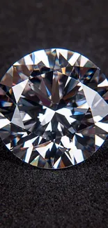 Close-up of a sparkling diamond on a black surface.