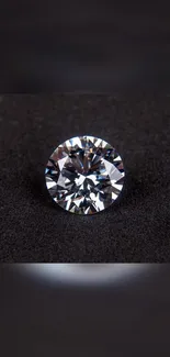 Glittering diamond on sleek black background.