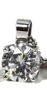 Close-up of a diamond pendant on chain.