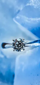 Ice blue background with elegant diamond ring.