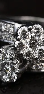 Elegant diamond ring with sparkling gems set on dark background.