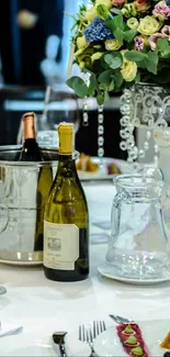 Elegant dining table with wine and flowers.