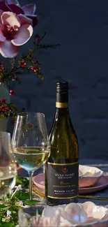 Elegant dinner table setting with wine and flowers.