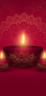 Elegant Diwali candles with intricate mandala design on crimson red background.