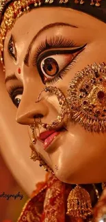 Close-up of Durga with intricate gold details and vibrant colors.