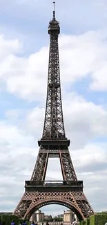 Elegant view of the Eiffel Tower in Paris against a blue sky.