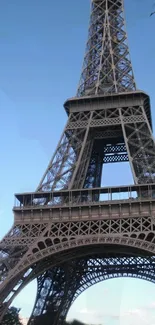 Eiffel Tower against a clear blue sky.