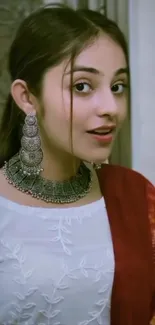 Portrait of a woman in traditional ethnic attire with silver jewelry.