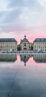 European architecture with sunset reflection over water.