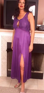 Woman in a purple evening dress, standing elegantly in a living room.