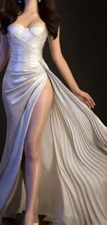 Elegant woman in ivory evening gown with flowing skirt.