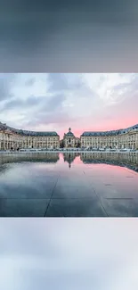 Reflected classical architecture at sunset.