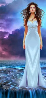 Fantasy woman in white gown standing on ocean with colorful, dramatic sky.