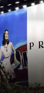 Elegant Prada fashion billboard illuminated at night in cityscape background.