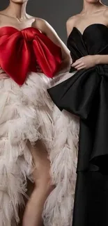 Two elegant strapless gowns in red and black with large bows.