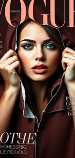 Fashion portrait of a woman in a hooded cloak on a magazine cover.