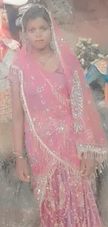 Woman in elegant sari with colorful backdrop.